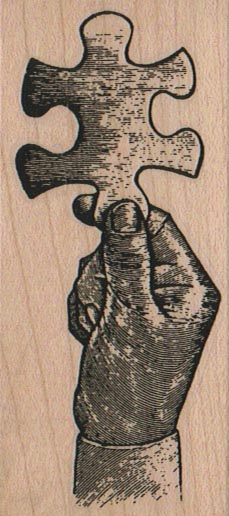 Hand Holding Jigsaw Puzzle Piece 1 1/2 x 3 1/2